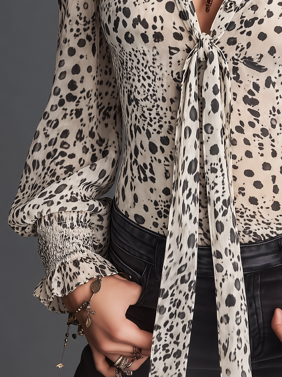 Chic Ivory Blouse with Embroidered Details and Animal Print Accents