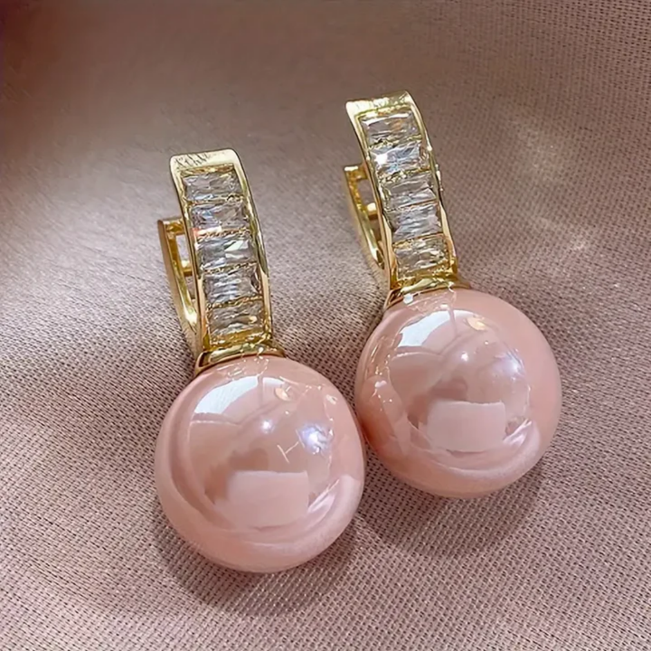 Gold earrings with pink zircon
