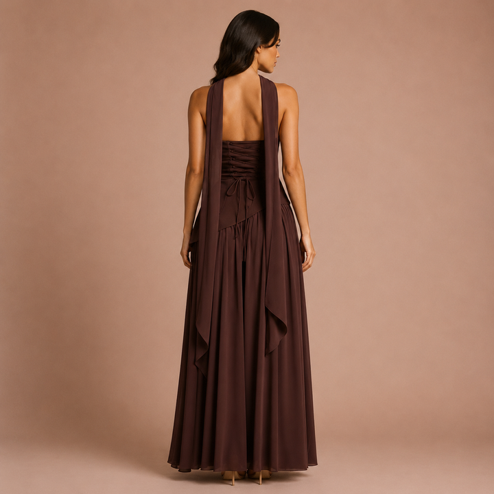 Long dress with a high slit and fluid details at the neckline