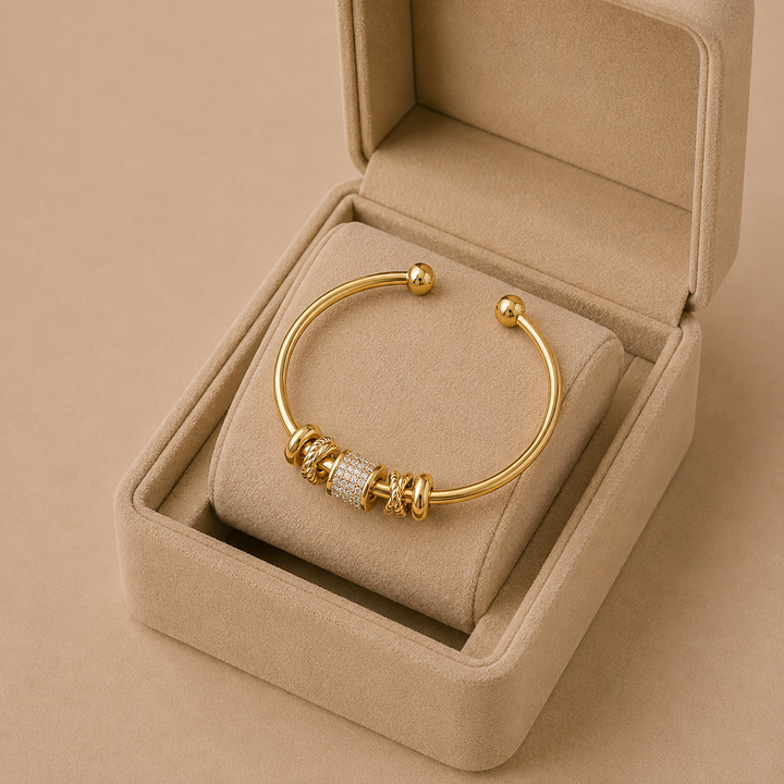 Adjustable bracelet with gold pendants