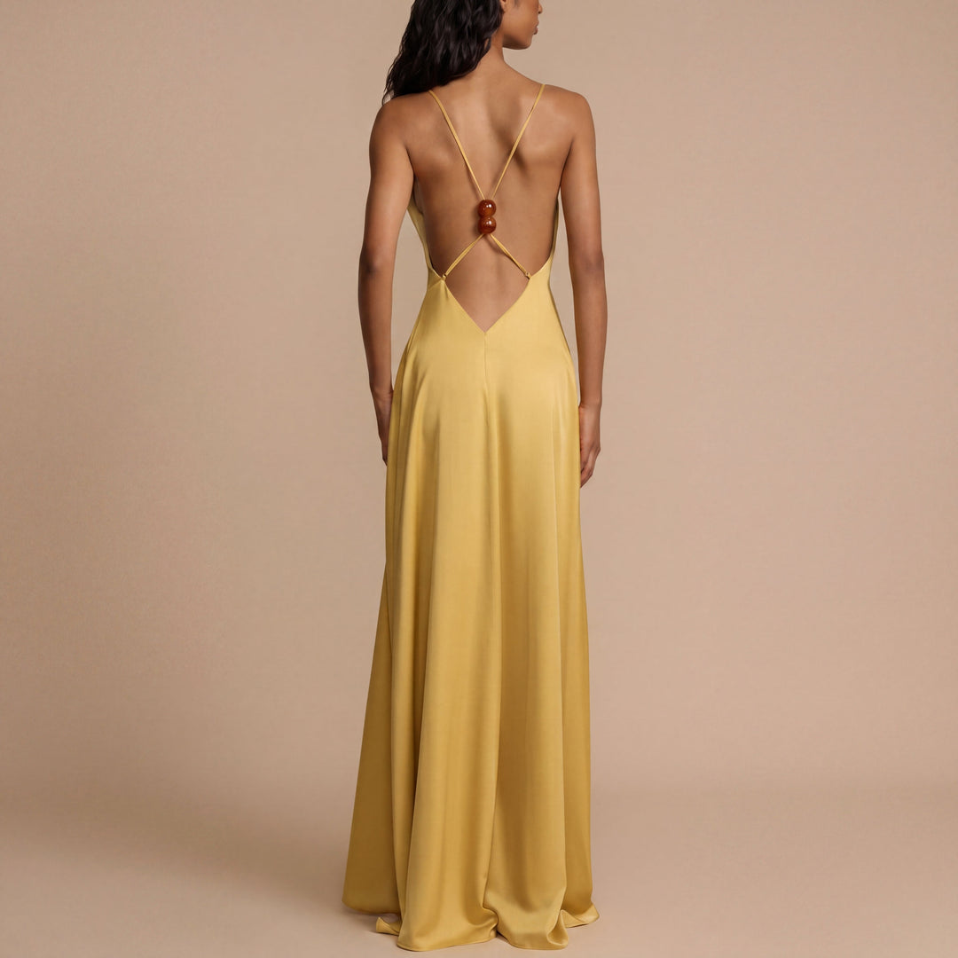 Noa – Long dress with a striking neckline and flowing silhouette